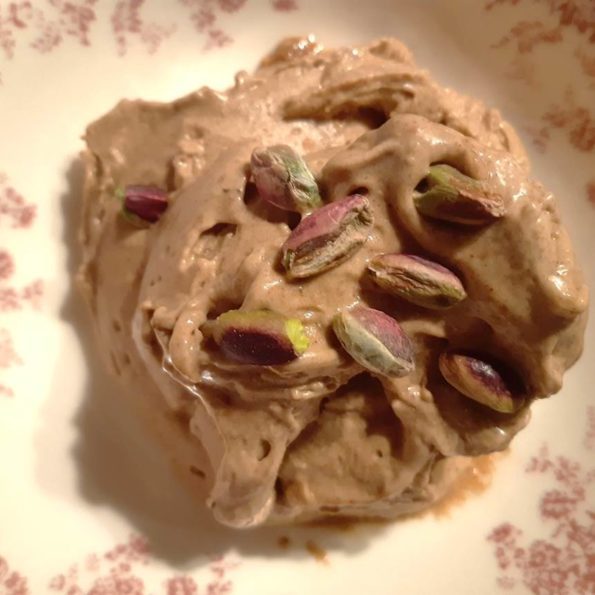 banana peanut butter ice cream ball decorated with pistachios