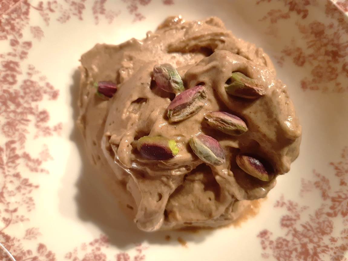 banana peanut butter ice cream ball decorated with pistachios