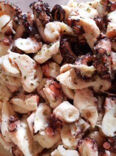 Dish with cooked octopus chunks