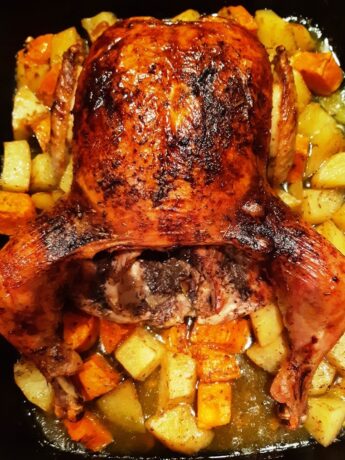 roast chicken with potatoes in a pan