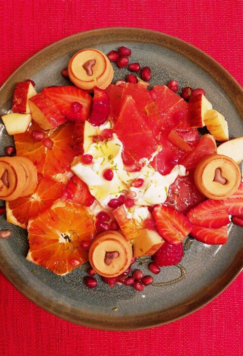 Plate with red fruits and yoghurt