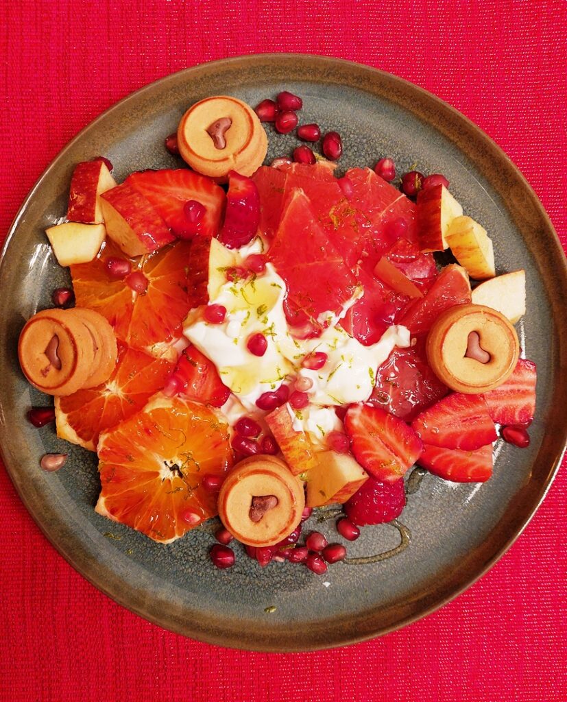 Plate with red fruits and yoghurt
