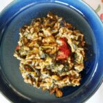 Blue dish with spinach risotto.