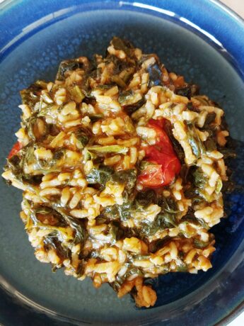 Blue dish with spinach risotto.