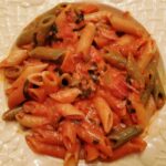 Dish with penne and tomato sauce