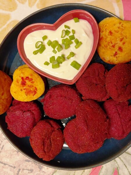 red beetroot balls in a plate with white dipping sauce